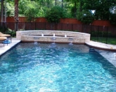 Geometric pool and spa combination with bubblers
