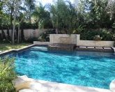 Geometric pool with raised spa